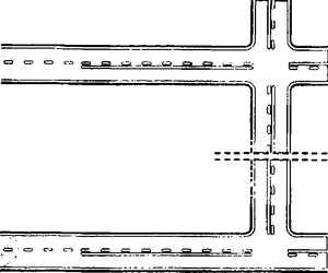 Fig. II 425 — STRISCE DI SEPARAZIONE DEI SENSI DI MARCIA